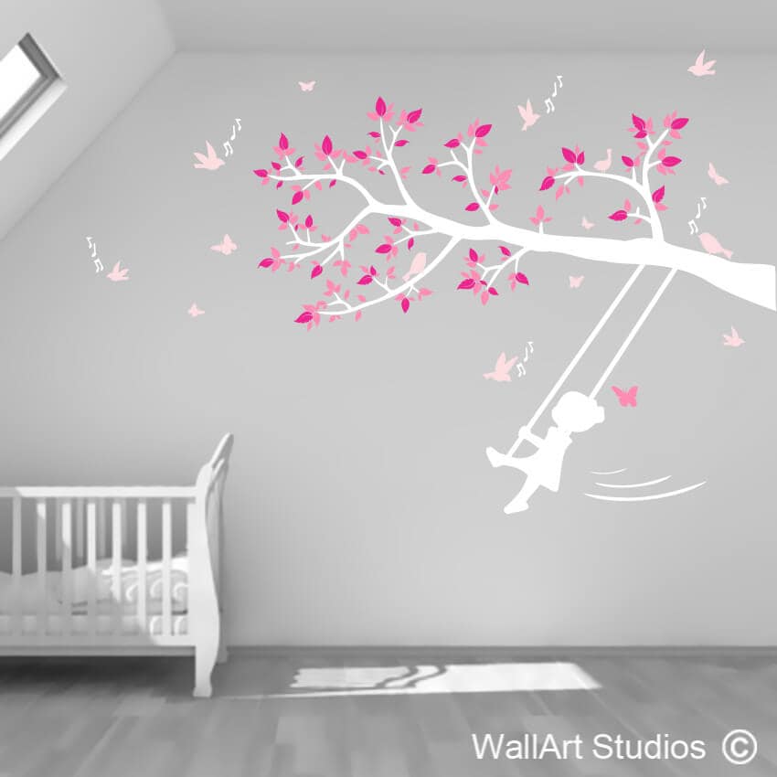 Little Girl Swinging on Tree Branch